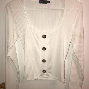 White shirt with brown buttons
